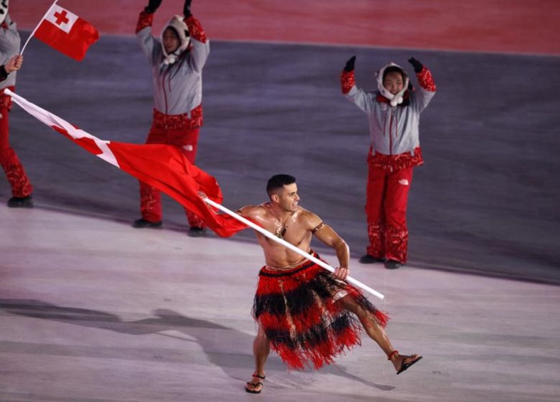 Tongan skier Pita Taufatofua caught international attention by representing his island in traditional clothing - or rather, lack of clothing - and carrying the national flag.