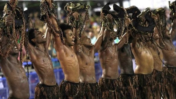 Revellers from Paraiso do Tuiuti Samba school perform in the city of Rio de Janeiro.