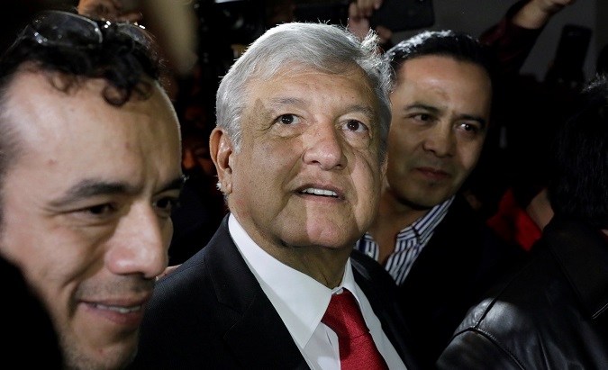 Andres Manuel Lopez Obrador (AMLO) leaves after being sworn-in as presidential candidate of the National Regeneration Movement (Morena) during the party's convention at a hotel in Mexico City, Mexico February 18, 2018.