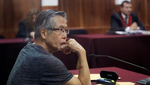 Peru's former President Alberto Fujimori arrives in court during the sentencing in his trial on charges of embezzling state funds to manipulate the media during his tenure as president, in Lima, Peru January 8, 2015