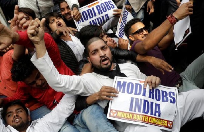Activists of the youth wing of India's main opposition Congress party shout slogans during a protest against billionaire jeweller Nirav Modi in New Delhi on Feb. 16.