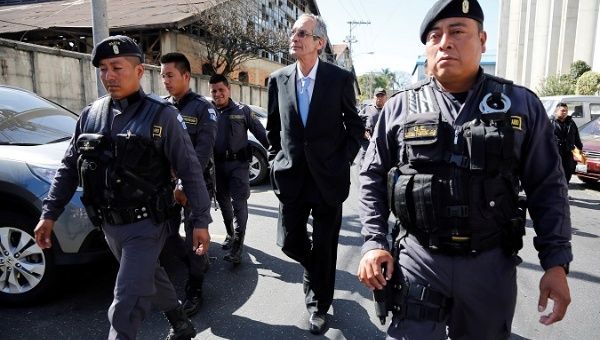 Former Guatemalan President Alvaro Colom arrives to a court hearing as part of a local corruption investigation in Guatemala City, Guatemala Feb. 23, 2018.