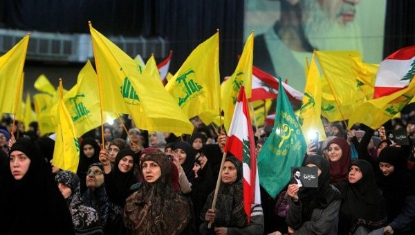 Supporters of Lebanon's Hezbollah listen to leader Sayyed Hassan Nasrallah as he speaks via video link in Beirut.