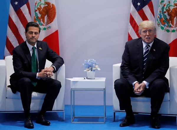 Mexican President Enrique Peña Nieto (L) has postponed plans for his first visit to U.S. President Donald Trump's White House after a testy phone call.