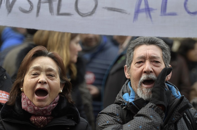 People take part in a pensioners' protest demanding higher state pensions in Oviedo, Spain.