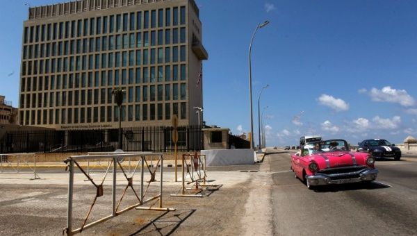 A vintage car drives in front of the U.S. Embassy in Havana, Cuba, March 2, 2018.