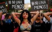 A demonstrator depicting lacerations is seen during a peaceful march against the gender violence.