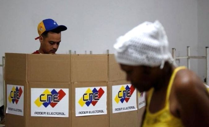 A man and woman prepare to vote in Venezuela's Constituent Assembly election in Caracas last year.