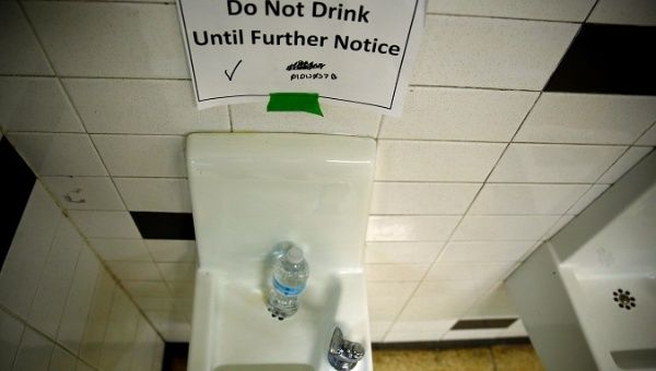 A sign which reads 'Do Not Drink Until Further Notice' appears next to a water dispenser at North Western high school in Flint, Michigan, U.S., May 4, 2016.