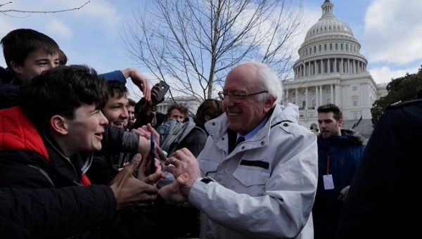 Senator Sanders greets students outside the U.S. Capitol during walk-outs in support of stricter gun laws in Washington.