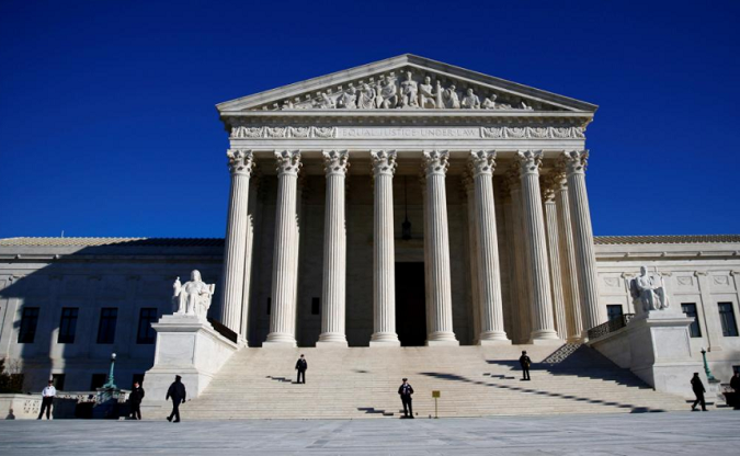 Police officers stand in front of the U.S. Supreme Court in Washington, DC, U.S., January 19, 2018.