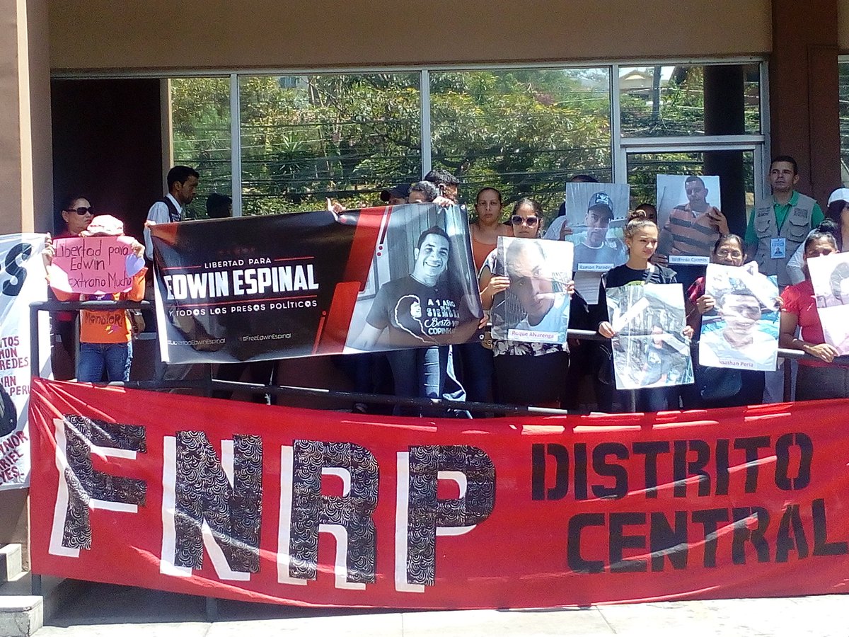 Members of the Honduras Solidarity Network protest outside the office of the Public Prosecutor in Honduras' capital, Tegucigalpa, on Monday.