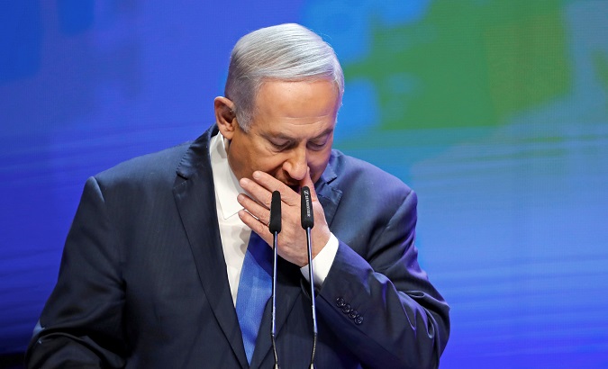 Israeli Prime Minister Benjamin Netanyahu coughs as he addresses a health conference in Tel Aviv, Israel, March 27, 2018.