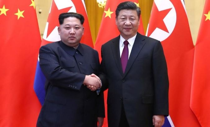 Xi (R) has been a longstanding ally of Kim's government.