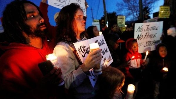 Demonstrators gather to protest the police shooting of Stephon Clark, in Sacramento, California. The 22-year-old father of two was shot 20 times by authorities.