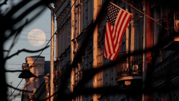 The full moon rises in the sky next to the U.S. Consulate General in St. Petersburg, Russia March 30, 2018.