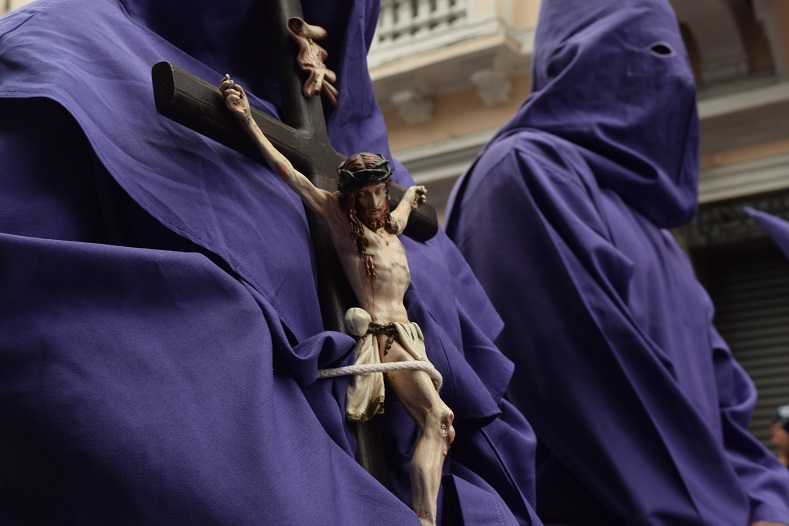 Hidden behind the veil of purple, Christians honor an age-old tradition which dates back to medieval Spain.