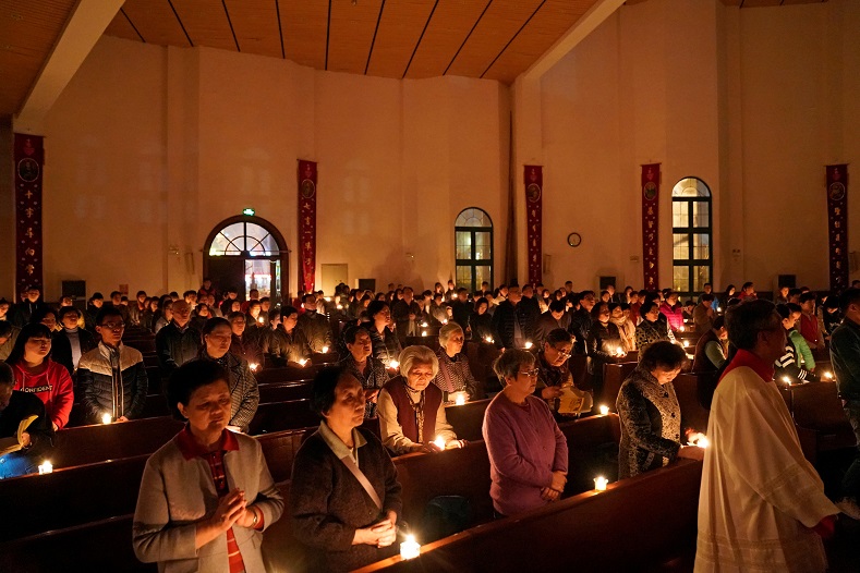 Chinese Catholics attend the Easter Vigil at a church in Shanghai, China, March 31.
