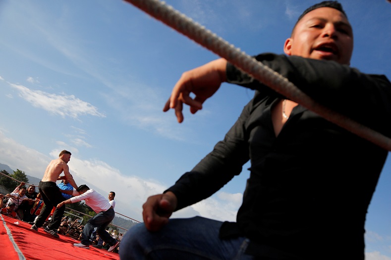Men take part in a bare-knuckle fight as part of a local tradition on Good Friday during Holy Week in the town of Chivarreto, on the outskirts of Guatemala City, March 30.
