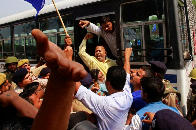 People belonging to the Dalit community shout slogans as they are detained by the police during a protest following a nationwide strike called by Dalit organisations, in Chandigarh, April 2, 2018.