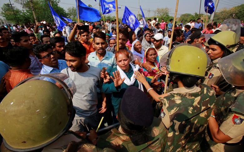 Police try to stop people belonging to the Dalit community as they take part in a protest during a nationwide strike called by Dalit organisations, in Chandigarh, April 2, 2018.