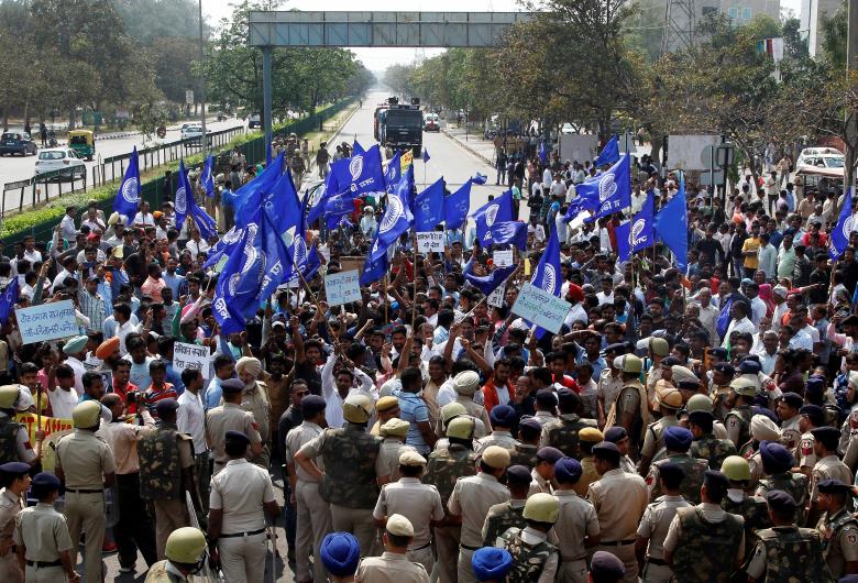 Police try to stop people belonging to the Dalit community as they take part in a protest during a nationwide strike called by Dalit organisations, in Chandigarh, April 2, 2018. 