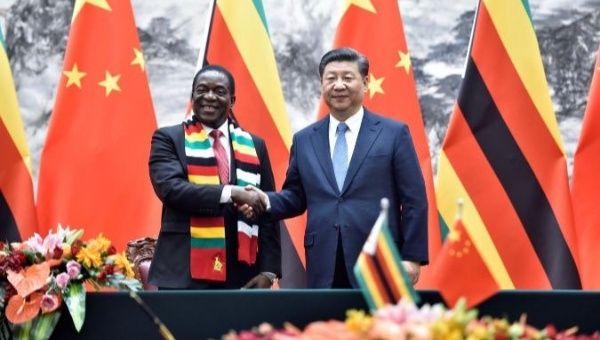 Mnangagwa (L) greets Xi during a state visit, to China, which runs from April 2 to 6.