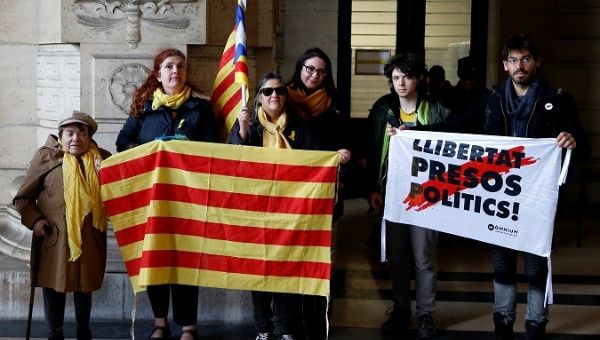 Supporters of ousted Catalan leader Puigdemont and his government are pictured outside Brussels Palace of Justice.