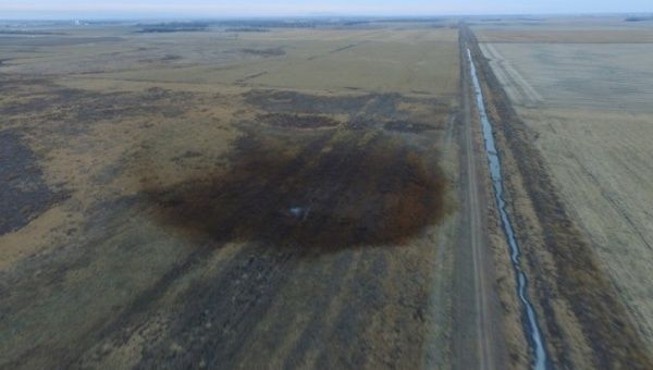 An aerial view shows the darkened ground of an oil spill which shut down the Keystone pipeline between Canada and the United States.