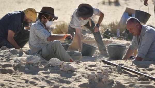 Research team of archaeologists and anthropologists escavate in the Arabian Desert.