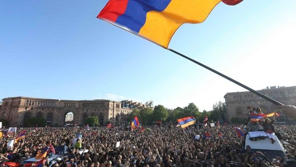 People celebrate after Armenian PM Sarksyan resigned following almost two weeks of mass street protests, in central Yerevan.