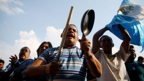 People take to the streets of Guatemala to depend the resignation of president Jimmy Morales.