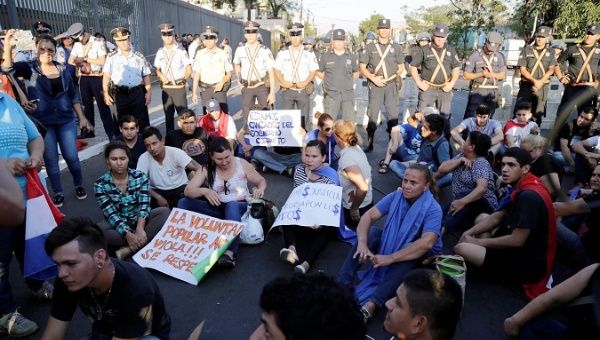Protesters gathered in front of the electoral court Tuesday to protest irregularities. 