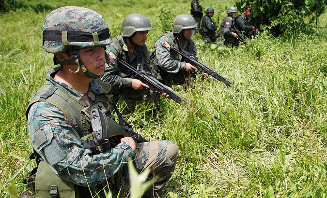 Ecuadorean soldiers guard the border in Narino, Colombia, April 18, 2018.
