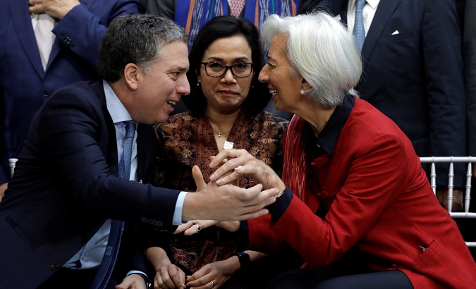 Indonesian Finance Minister (C) reacts as IMF Director Lagarde greets Argentina's Treasury Minister Dujovne during the IMF/World Bank spring meeting in Washington.