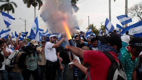 Anti-government protester fires homemade mortar during 