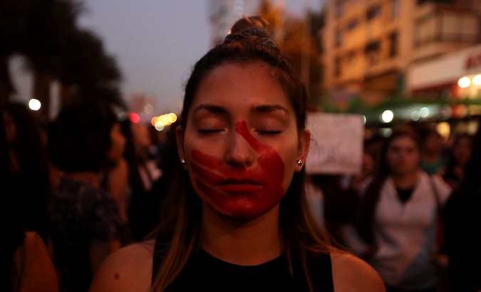 Women in Chile protest agains femicides. Femicides and gender-based violence continues to plague Latin America.