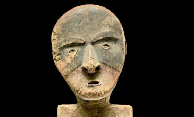 Among the looted artifacts returned to Alaska is this wooden figure, meant to ward off danger and death.