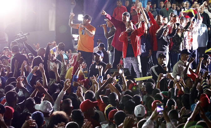 Venezuela's President Maduro stands with supporters after the results of the election were released in Caracas.