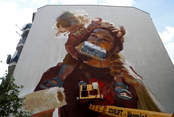 Dozens of large murals now adorn the city, from Moabit to Friedrichshain. Here's one by urban artist Case Maclaim.