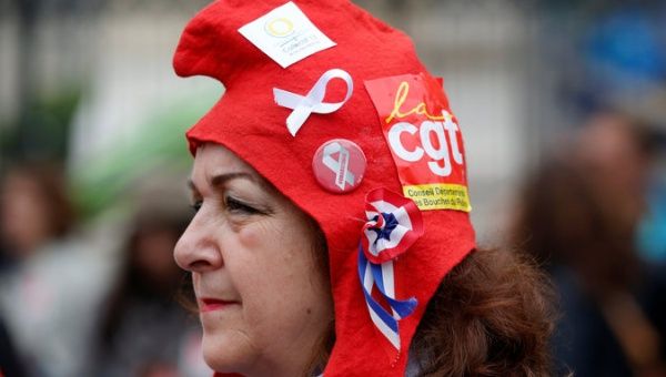 A French civil servant wears a CGT labour union sticker during a national day of strikes by public sector workers in Marseille