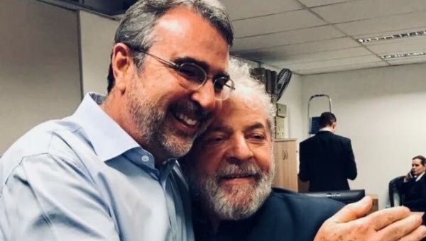 Congressman Henrique Fontana (Left) hugs former Brazilian President Lula.