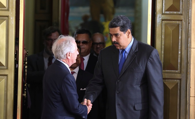 President Nicolas Maduro greets United States Senator Bob Corker.