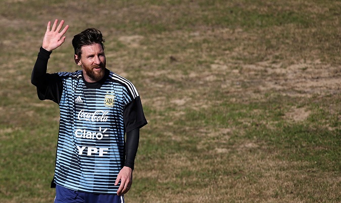 Lionel Messi of Argentina waves to the fans during a training session