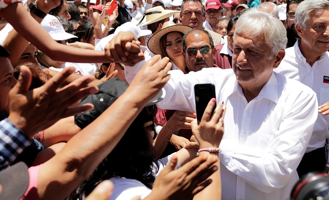 Leftist front-runner Andres Manuel Lopez Obrador of MORENA Party is greeted by supporters while arriving to a campaign rally in Michoacan state, Mexico.