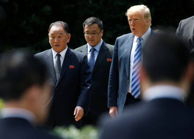 North Korean envoy Kim Yong Chol talks with U.S. President Donald Trump as they walk out of the Oval Office after their meeting at the White House.