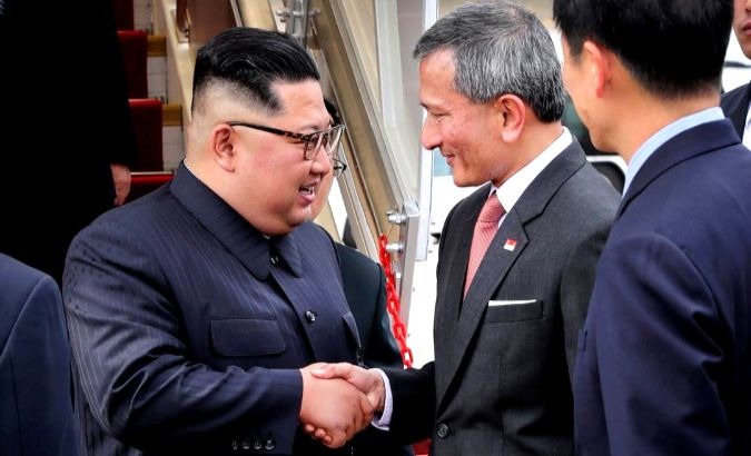 North Korean leader Kim Jong-un arrives in Singapore and is greeted by Singapore's Foreign Minister Vivian Balakrishnan.