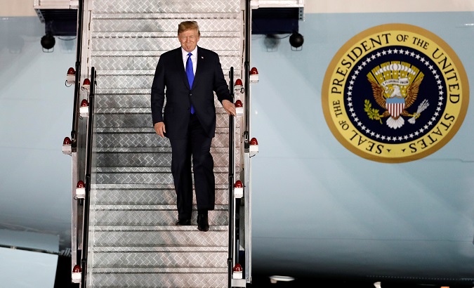 U.S. President Donald Trump steps off his plane at Paya Lebar Air Base in Singapore, ahead of a summit with North Korean leader Kim Jong Un, June 10, 2018.