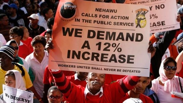 South African public sector workers march for higher pay during a protest in December 2017.