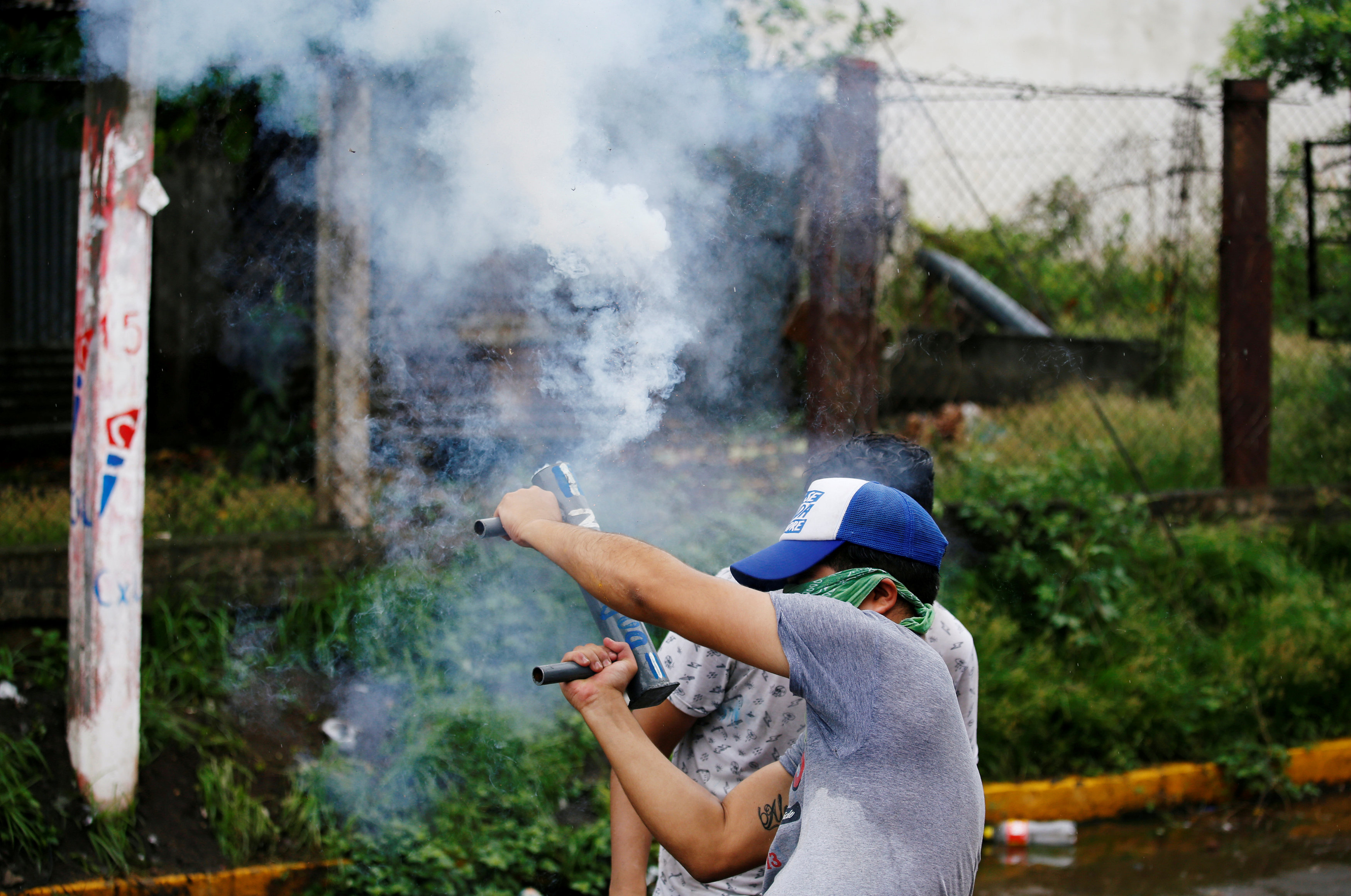 A demonstrator holds a homemade mortar during a protest against Nicaraguan President Daniel Ortega's government in Granada, Nicaragua June 6, 2018.